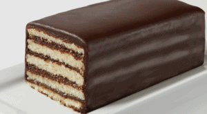 A vanilla cake with layers of chocolate icing.