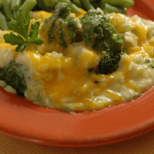 A close up shot of the Ukrop's Broccoli and Rice casserole showing broccoli and cheese.