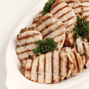 Grilled chicken breast on a plate.