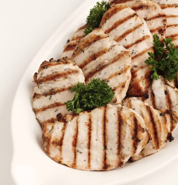 Grilled chicken breast on a plate.
