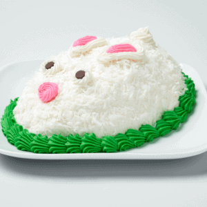 A white coconut cake iced to look like a bunny.