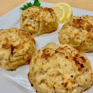 Four of Ukrop's Signature Crab Cakes on a plate.