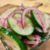 A close up of the cucumbers and onions in Ukrop's Marinated Cucumber Salad.