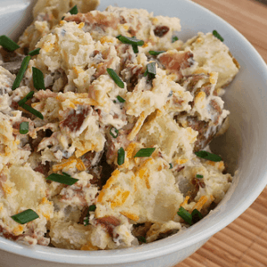 A bowl full of Ukrop's Loaded Baked Potato Salad.