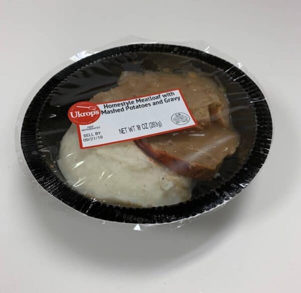 A single serving of Ukrop's Homestyle Meatloaf with Mashed Potatoes and Gravy.