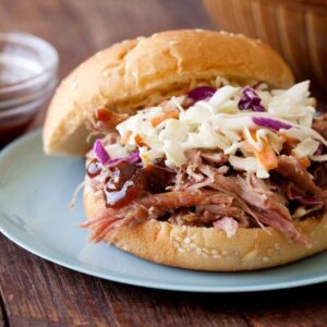 A barbecue sandwich on a plate.
