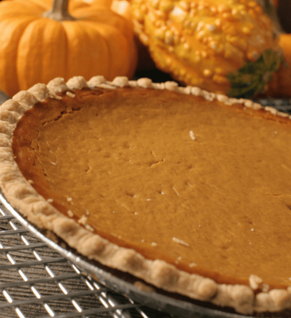 A close up shot of a pumpkin pie.