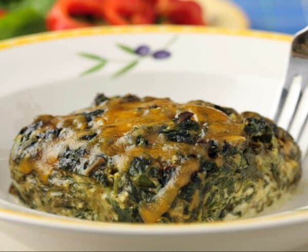 A plate with a portion os Ukrop's Spinach Supreme.