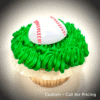 A cupcake with a baseball decoration.