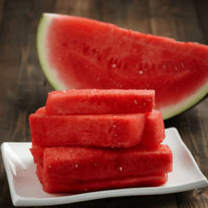 A plate with slices of watermelon on it.